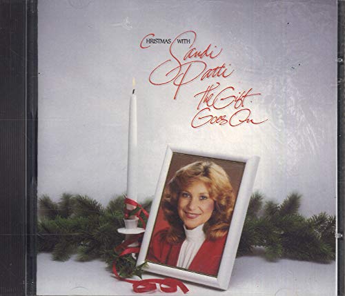 CD cover featuring Sandi Patti with a framed portrait and holiday decor.