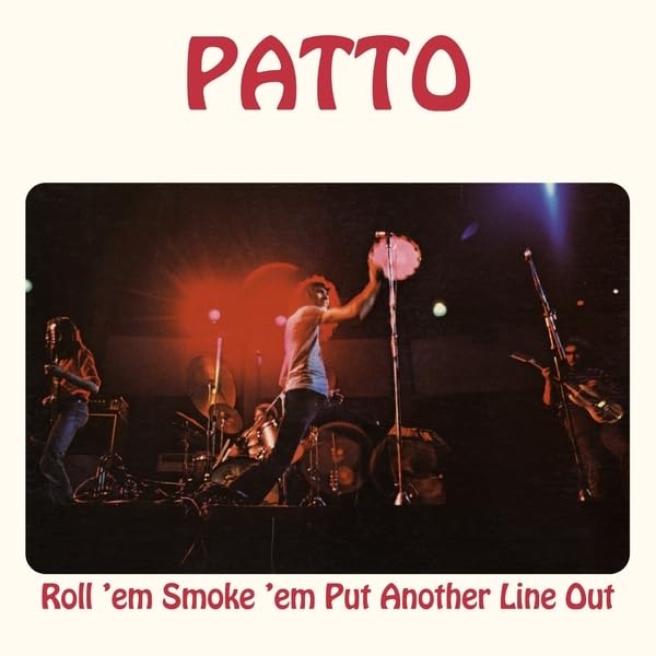 Vinyl album cover featuring a live band performing on stage in red lighting.