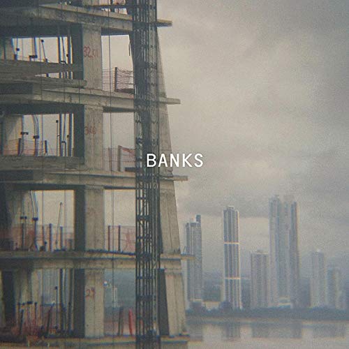 CD cover for Paul Banks' "Banks" featuring a concrete building facade.