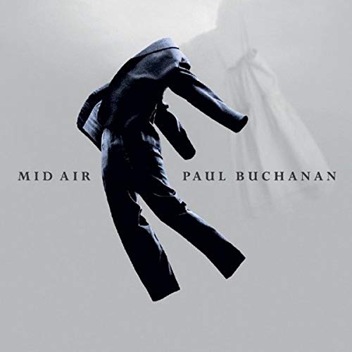 Album cover: a dark suit appears to float in a grey space.