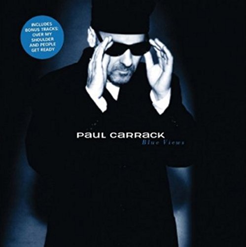 "Album cover with a man in black, adjusting sunglasses, against a dark background."