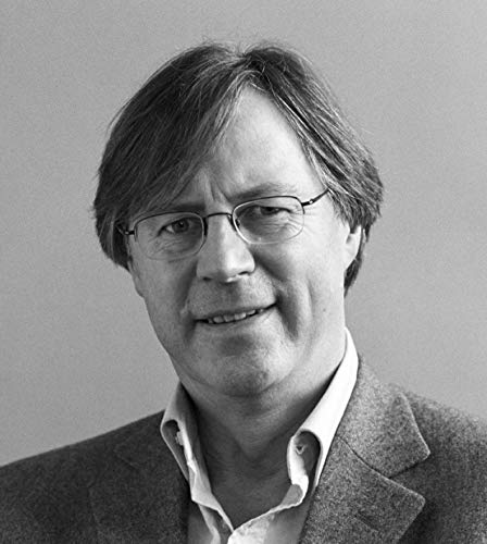 Black and white portrait of a man with glasses and short brown hair.