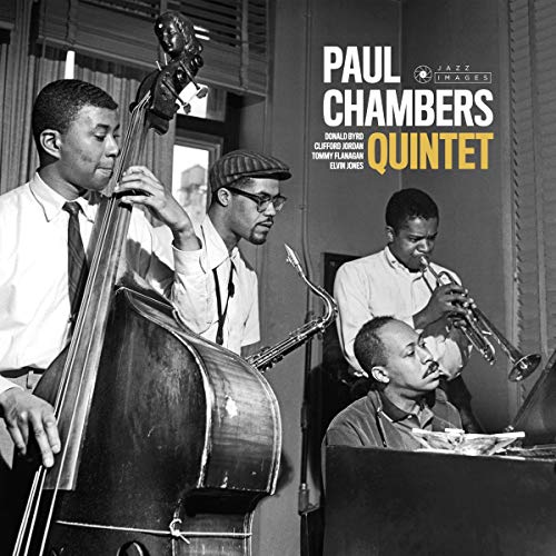 Black and white album cover featuring four jazz musicians playing instruments.