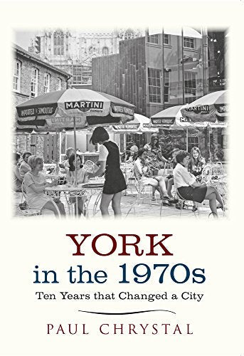 Black and white photo of people at outdoor cafe tables in York, 1970s.