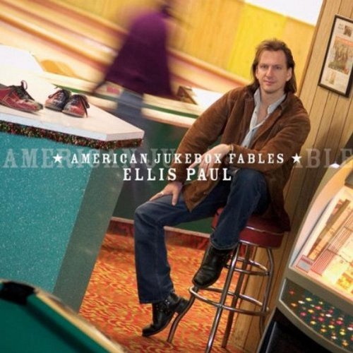 CD cover: Ellis Paul seated near a bowling alley and jukebox.