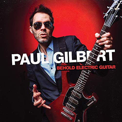 Paul Gilbert holding a red electric guitar, album cover art.