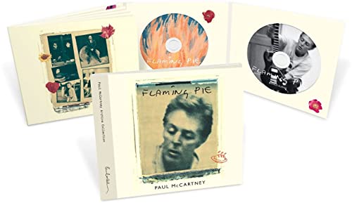 Paul McCartney's "Flaming Pie" CD packaging with photos and red flower details.