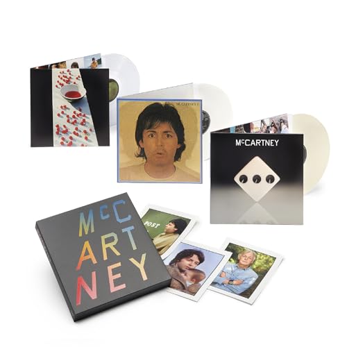 Paul McCartney album set with three vinyl records and photos.