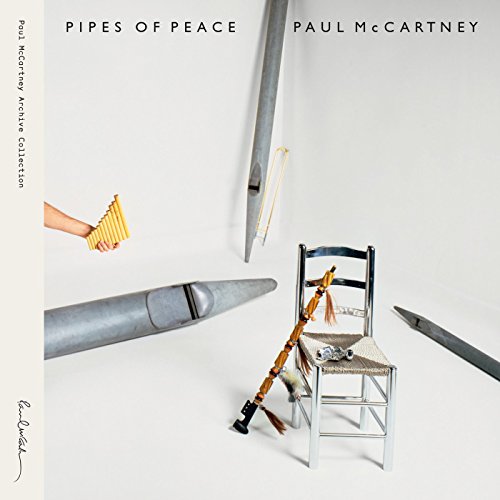 AlbumHanging pipes, a pan flute, and bagpipes arranged around a silver chair.S
