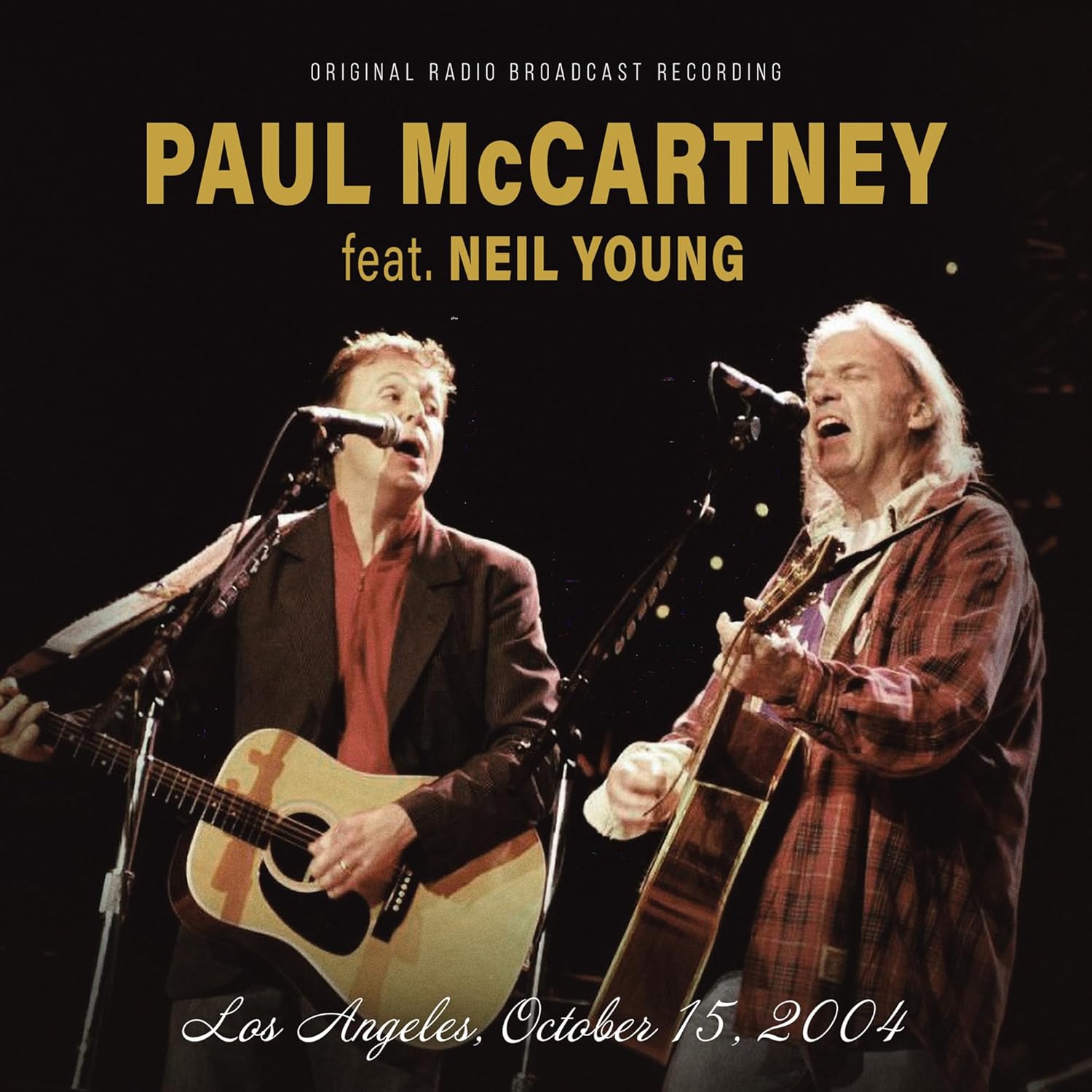Paul McCartney and Neil Young performing with guitars on stage, 2004.