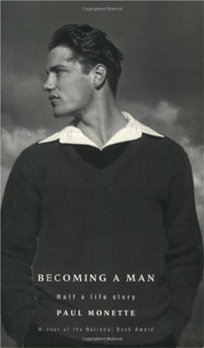 Black and white portrait of a young man wearing a sweater against a sky.