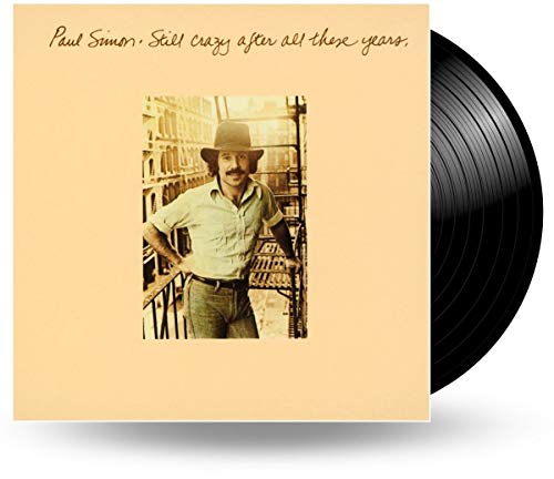 Paul Simon album cover with a photo of him wearing a hat on a fire-escape.