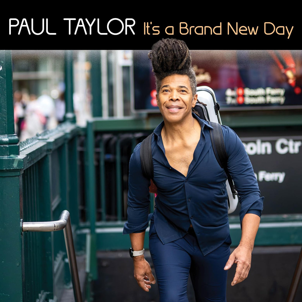 CD cover featuring Paul Taylor smiling in a New York City subway station.