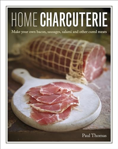 Book cover featuring sliced and whole cured meats on wooden boards.