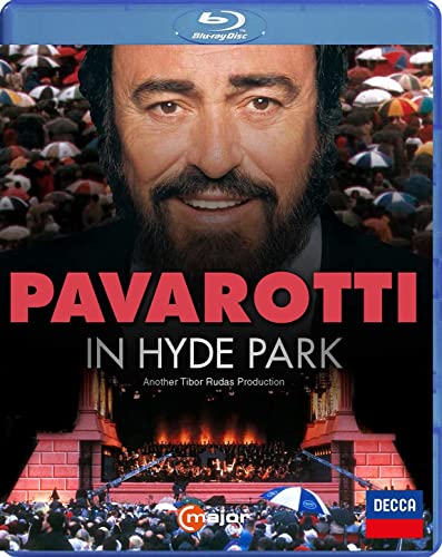 Luciano Pavarotti on Blu-ray cover, performing to a large, colorful crowd.