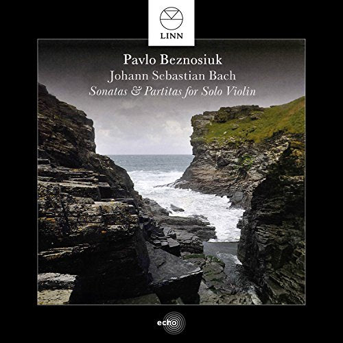 CD cover featuring a rocky coastal landscape with cliffs and ocean.