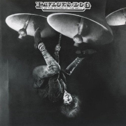 Black and white album cover featuring a person suspended amongst cymbals.