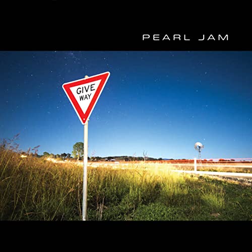 Pearl Jam “Give Way” CD cover: yield sign in a grassy field.
