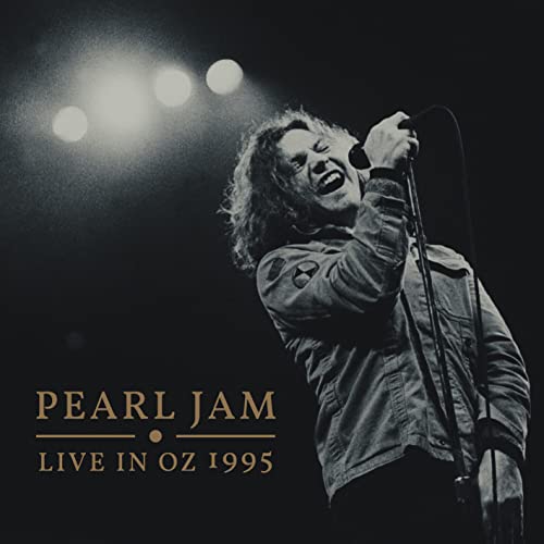 Pearl Jam’s Eddie Vedder singing into a microphone on album cover.