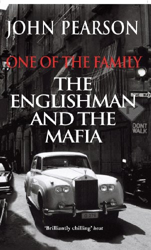 Book cover: vintage car in a city street, text “One of the Family”.