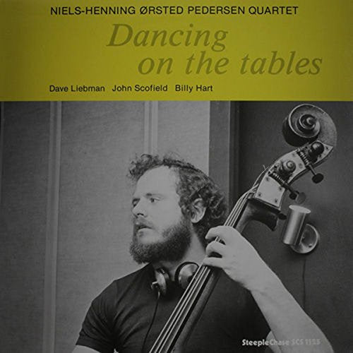Black and white album cover featuring a bassist with his instrument.