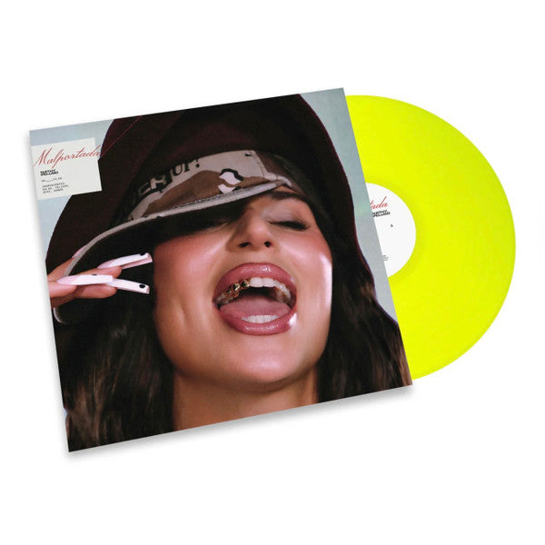 Vinyl record of Nathy Peluso’s “Malportada” album, with cover art and yellow disc.