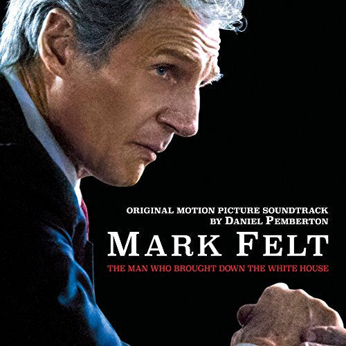 "Soundtrack CD cover featuring a close-up of an older man in a suit."