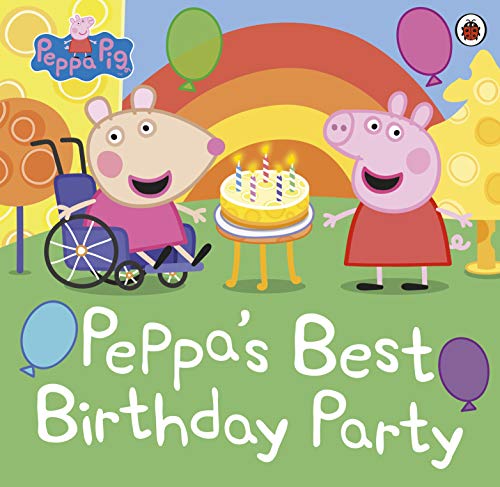 Peppa Pig and a friend in a wheelchair stand by a birthday cake.
