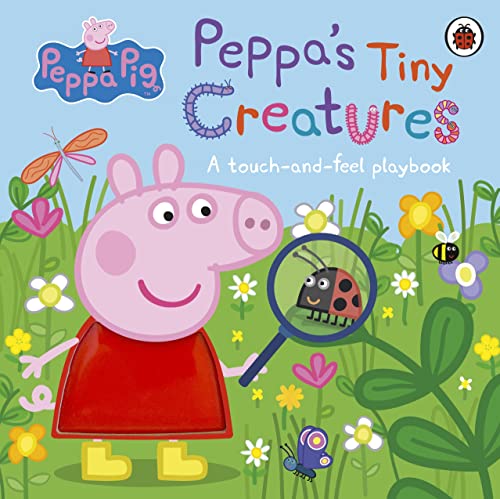 Peppa Pig holding a magnifying glass over a ladybug in a garden.
