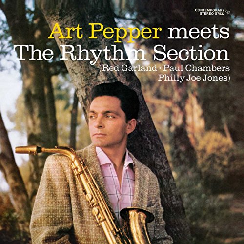Art Pepper album cover with a man holding a saxophone in a forest.