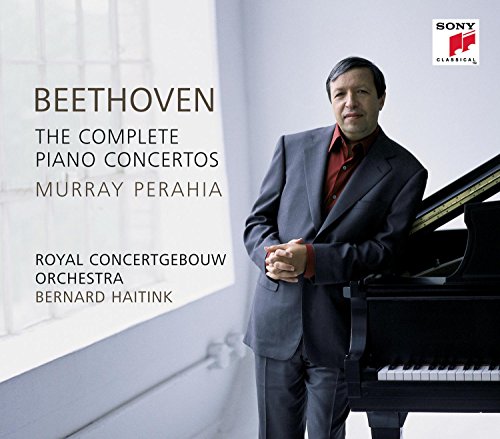 Murray Perahia in a suit leaning against a grand piano, with album text overlay.