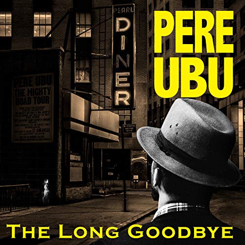 A man in a fedora stands before a city street with a diner sign.