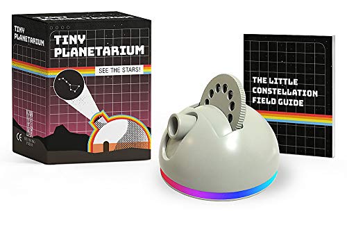 Gray planetarium projector with accompanying constellation field guide book.