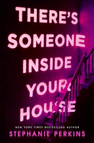 Book cover with pink neon text on a dark wall beside a staircase.