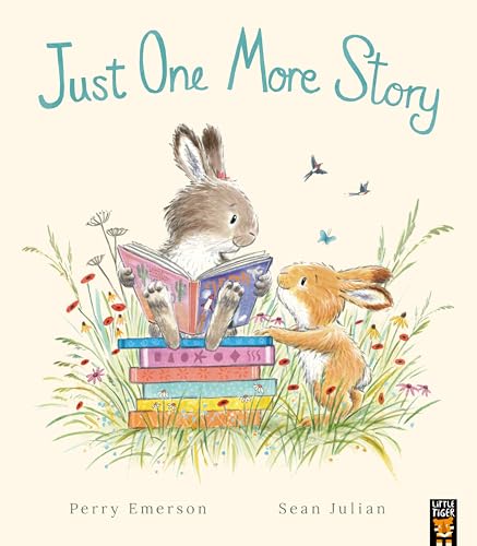 Bunny reading a book to another bunny in a grassy field.