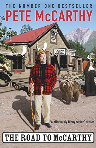 Book cover featuring a man in plaid standing before a rustic lodge.