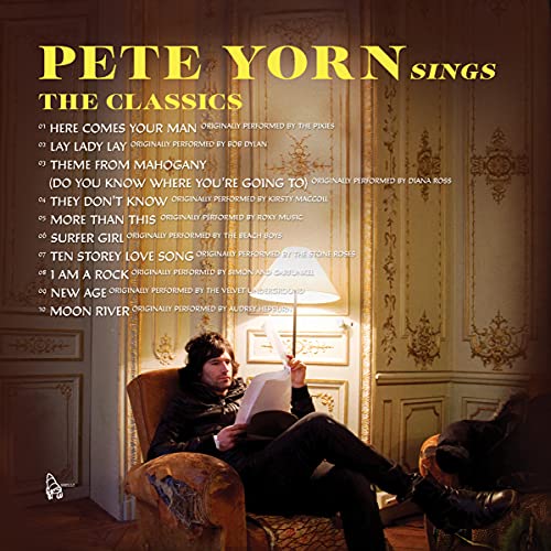Pete Yorn album cover featuring a man in a chair reading music.