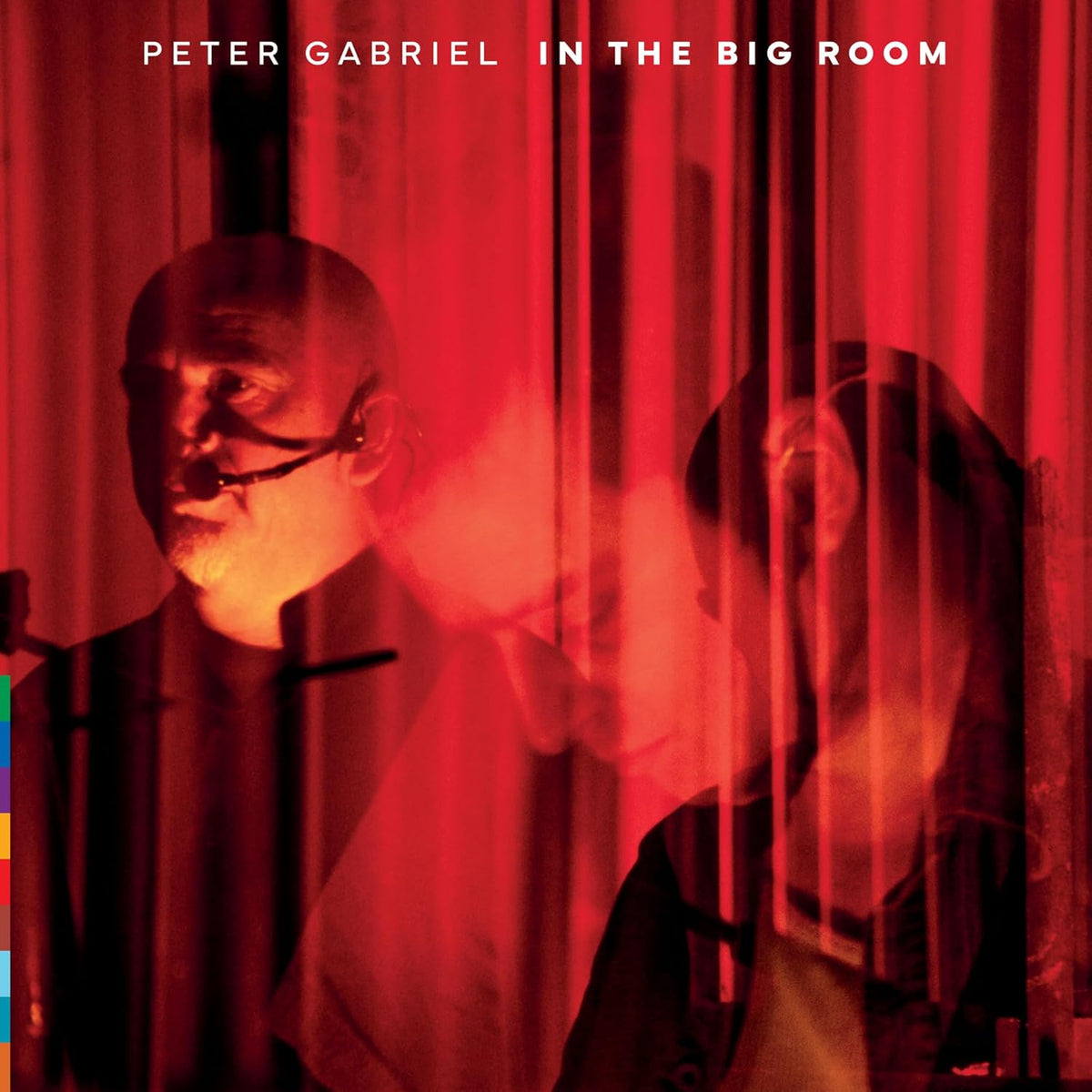 Peter Gabriel album cover, red curtains, portrait of a man in shadow.