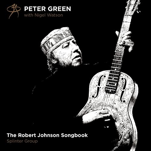 Black and white portrait of Peter Green playing a resonator guitar against black background.
