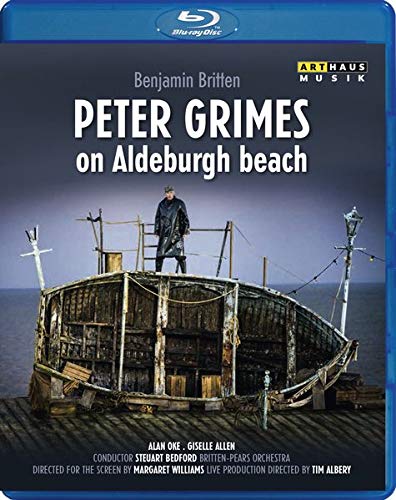 Blu-ray cover featuring a man standing on a damaged boat on a beach.