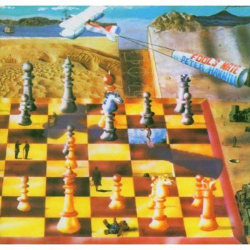 "Album cover featuring a chessboard with surreal landscape and airplane in the background."