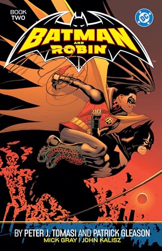 Comic book cover featuring Batman carrying Robin against a sunset backdrop.