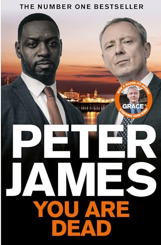 Book cover featuring two men’s faces against a cityscape backdrop, title “You Are Dead”.