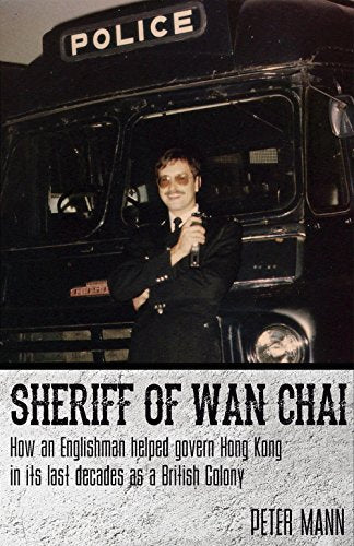 Book cover: man in police uniform with a bus in background.