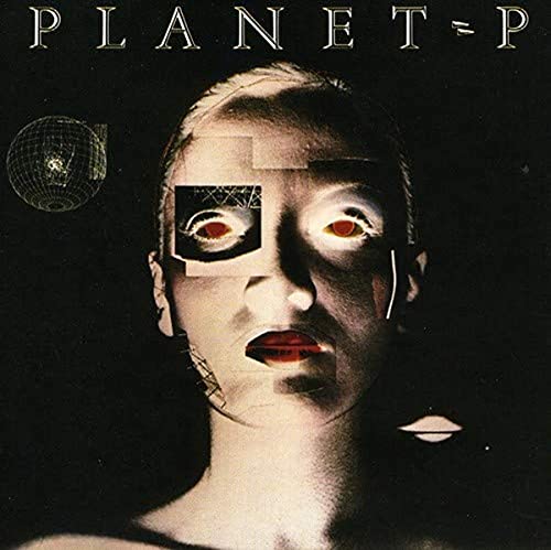Peter Murphy album cover: fragmented portrait with geometric shapes and red eyes.