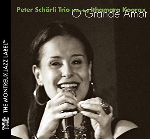 CD cover featuring a smiling woman singing into a microphone.