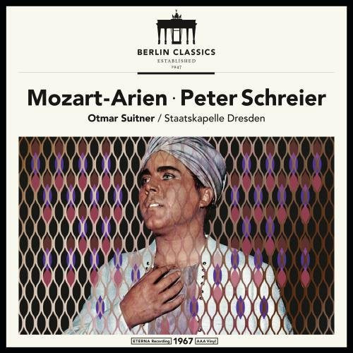Vinyl record cover with a man in a turban against a patterned background.