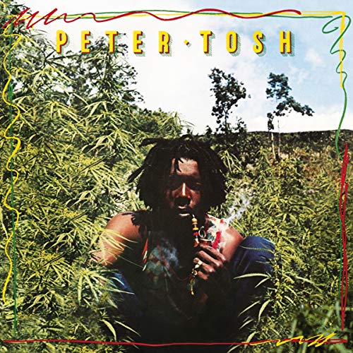 Peter Tosh album cover: man smoking surrounded by cannabis plants.