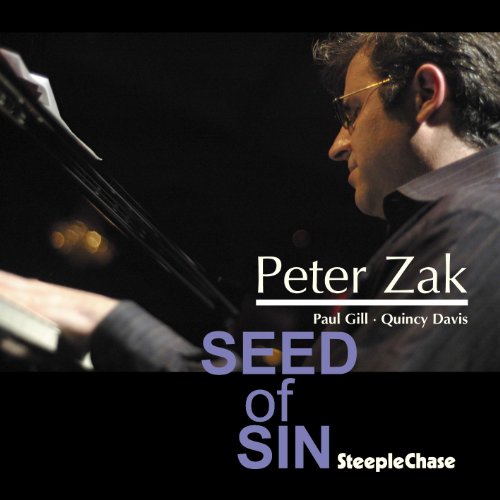 Peter Zak playing piano on the Seed of Sin album cover.