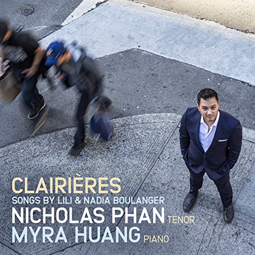 "Album cover with man in suit on sidewalk and blurred passersby, featuring title and artist names."